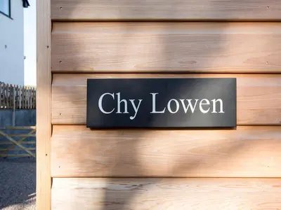 a sign that says cityhaven on a wooden wall at Chy Lowen in St Ives