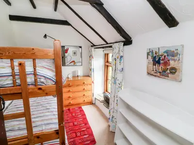 a bedroom with a bunk bed in a room at Meadow Lea in Liskeard