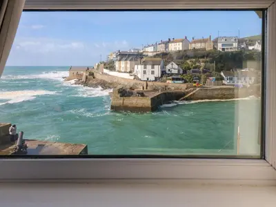 a view of the ocean from a window at Sea Star in Porthleven