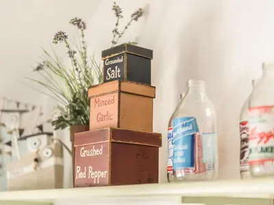 three boxes sitting on a shelf next to a bottle of milk at The Snug in Bugle