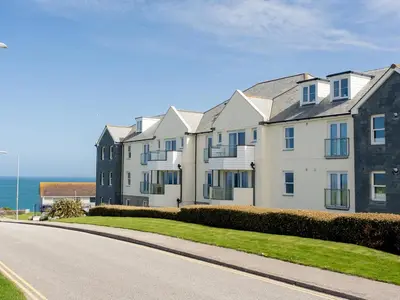 a row of houses on the side of a road at Cribbar View in Newquay
