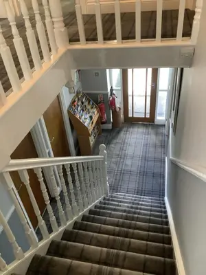 a staircase leading up to the basement of a house at Beechwood House in St Ives