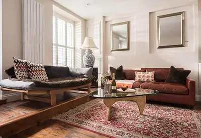 a living room with a couch and a coffee table at Quayside in Mevagissey
