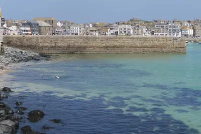a bridge over a body of water with buildings at The Loft in St Ives