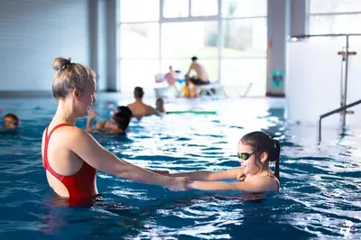 a woman and a girl in a swimming pool at Atlantic Reach Resort in Newquay