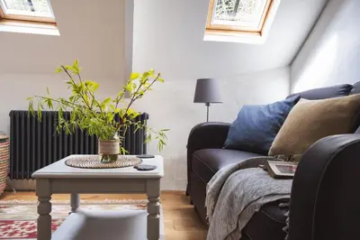 a living room with a couch and a table at St Kew Escapes Nr Port Isaac in Saint Kew