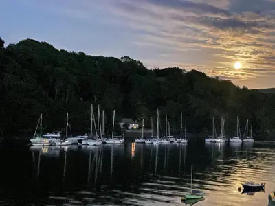 a group of boats docked in a body of water at Fowey River Views in Fowey