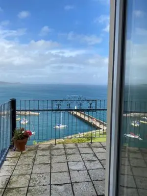a view of the ocean from a balcony at Honeycombe House in Mevagissey