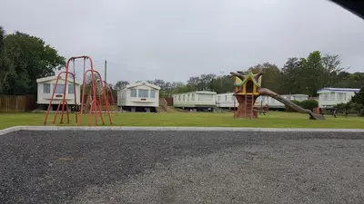 a playground with a slide in a park at C28 Angels retreat in Par