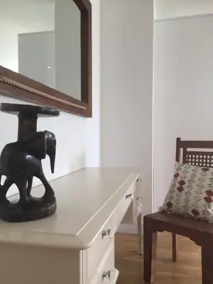 a mirror on top of a dresser with a horse statue at SeaQuest 8 in Newquay