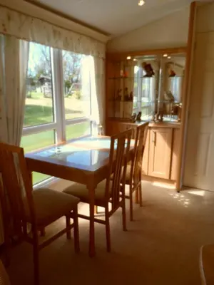 a kitchen with a table and chairs and a window at Peace and quiet in countryside location near Perranporth in Perranzabuloe
