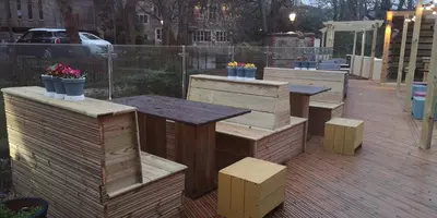 a group of tables and benches on a patio at Barley Sheaf, Old Bridge Street EN SUITE ROOMS, ROOM ONLY in Truro