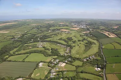 an aerial view of green fields and houses at Bowood Park Hotel in Camelford
