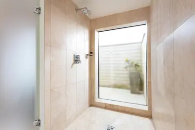 a bathroom with a shower with a window at Scarlet Hotel - Adults Only in Mawgan Porth
