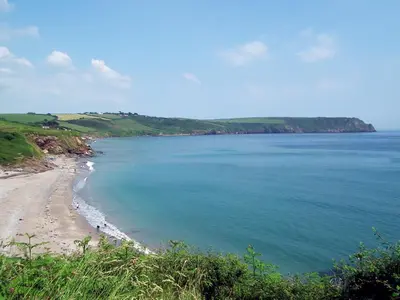 a view of a beach and the ocean at Moonrakers in Ruan Lanihorne