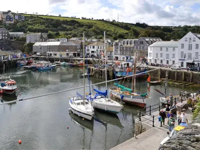 a group of boats are docked in a harbor at Penfose Apartment in Mevagissey