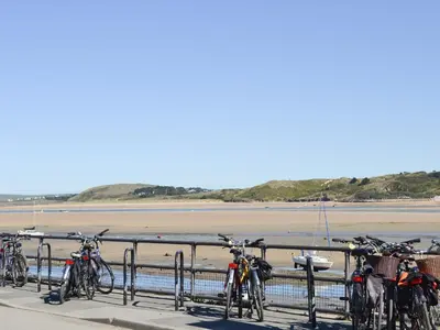 a group of bikes parked next to the beach at Little Tregarthen in Padstow