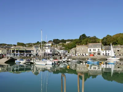 a group of boats docked in a harbor at Little Tregarthen in Padstow