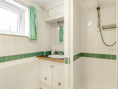 a bathroom with a sink and a shower at Studio Sea Urchin in Carbis Bay