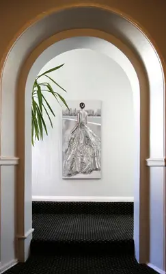 a room with a picture of a dress on a wall at Westberry Hotel in Bodmin