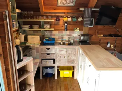 a kitchen with a sink and a counter top at Enys Boathouse in Porkellis