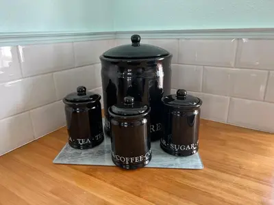 a group of three coffee pots sitting on a counter at Rosevean Cottage St Agnes in St. Agnes