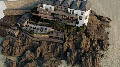 a building on top of a mountain on a cliff at Pedn-Olva in St Ives