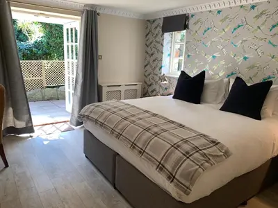 a bedroom with a large bed in a room at Boscundle Manor in St Austell