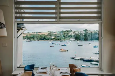 a view of a harbor from a restaurant window at Greenbank Hotel in Falmouth