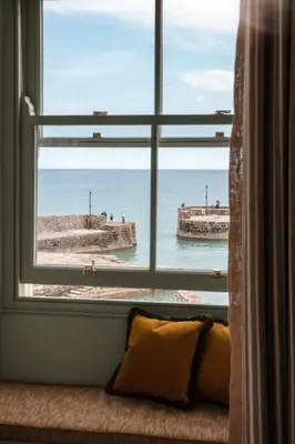 a window with a view of the ocean at Pier House in St Austell