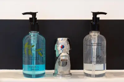 a couple of bottles of detergent and aeper at Oasis House in Falmouth