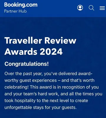 a sign that says travel review awards at The garden apartment in St Ives