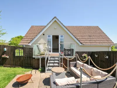 a small house with a fence and a patio at Treview in Launceston