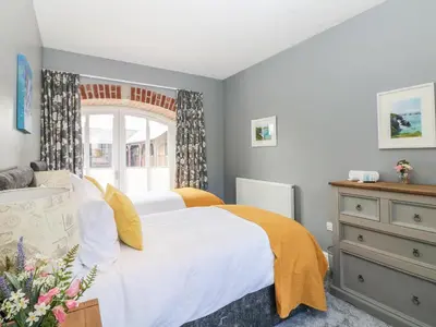 a bedroom with a bed and a window at Dexter in Penryn