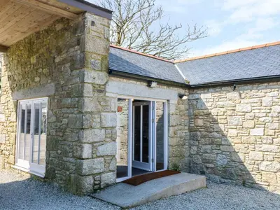 an entrance to a stone building with a door at Dexter in Penryn