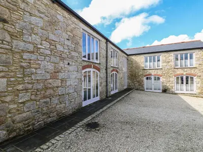 an external view of a brick building with a driveway at Argal in Penryn