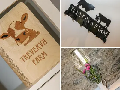 a picture of a sign with a cow and a happy farm sign at Helford in Penryn