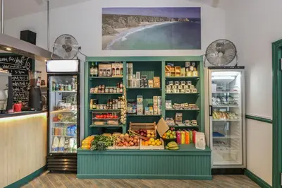 a produce section of a grocery store with fruits and vegetables at Bramble Cottage in Falmouth