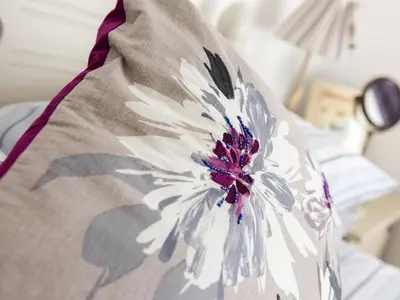 a close up of a pillow with a flower on it at The Old Sweet Shop in Par