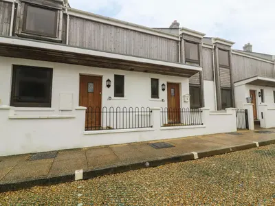 a row of houses on the side of a street at 4 Bredon Court in Newquay