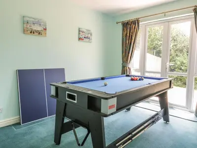 a billiard table in a room with at 12 Kel Avon in Truro