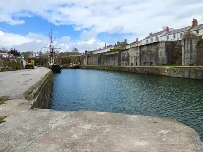 a river in a city with a boat in it at Tyack in Charlestown
