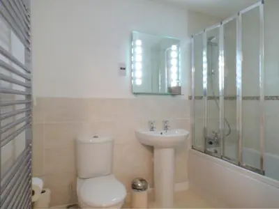 a bathroom with a toilet and a sink and a shower at Tyack in Charlestown