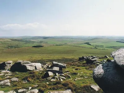a view of a field with rocks on a hill at The Old Engine House in Bodmin