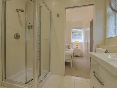 a bathroom with a shower and a sink at Rock Rose in Downderry