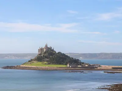 a castle on an island in the water at 2 The Cottages in Ludgvan