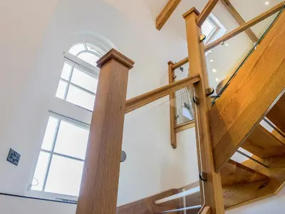 an image of a wooden staircase in a house at Moor View Chapel in Camelford
