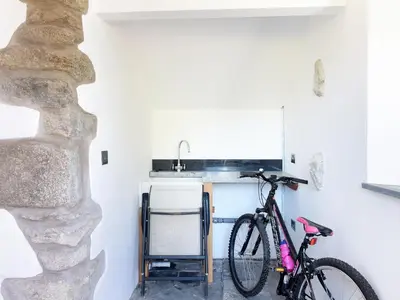 a bike parked in a kitchen next to a sink at Moor View Chapel in Camelford