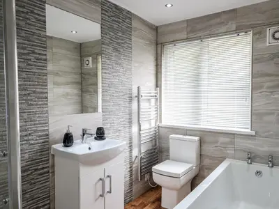 a bathroom with a toilet and a sink and a tub at Little Retreat in Liskeard