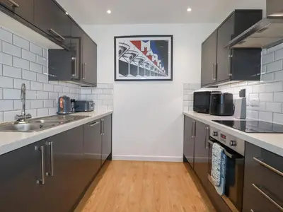 a kitchen with a sink and a counter top at Buena Vista in Newquay